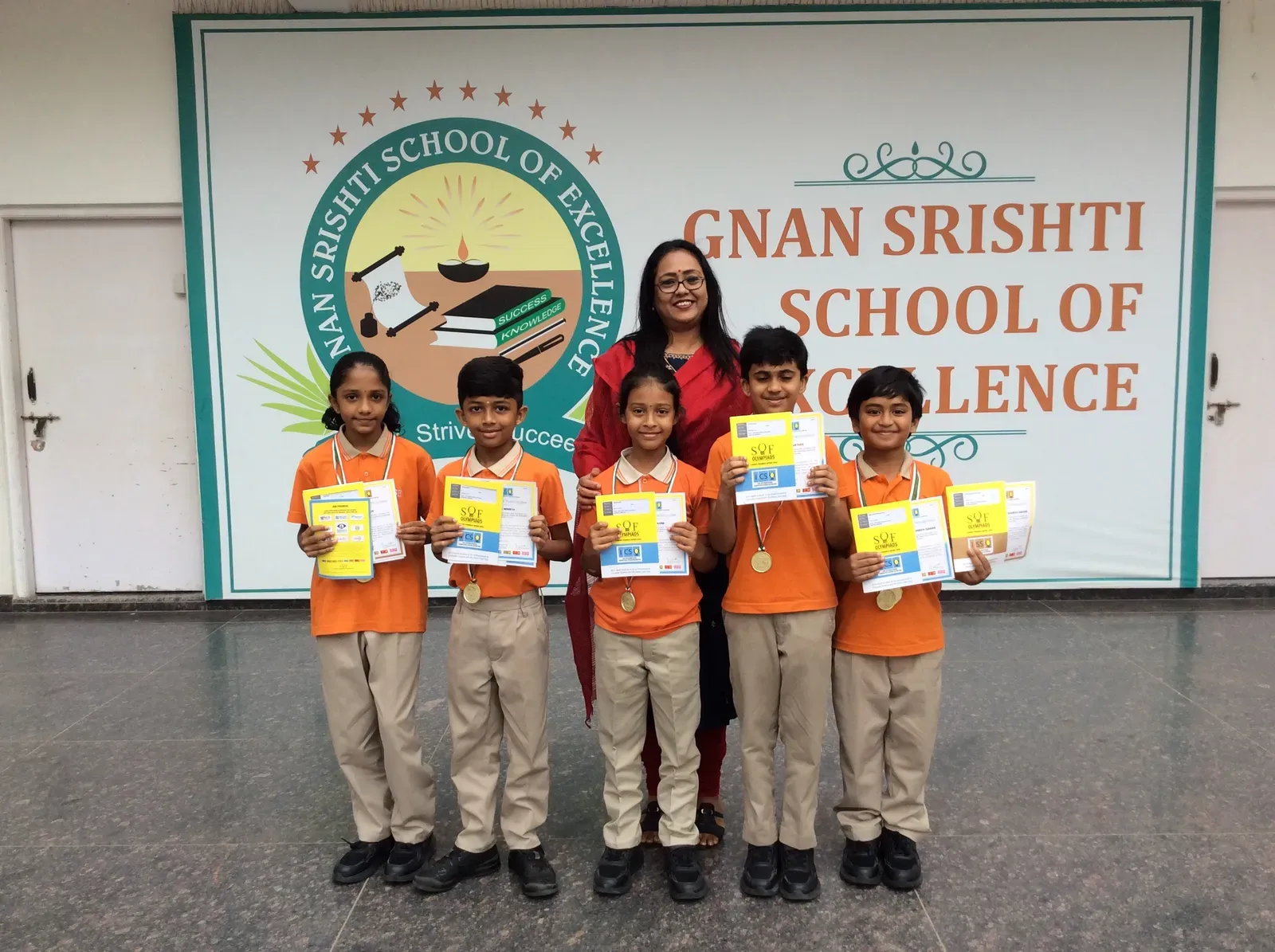 GSSE students with their certificates and medals