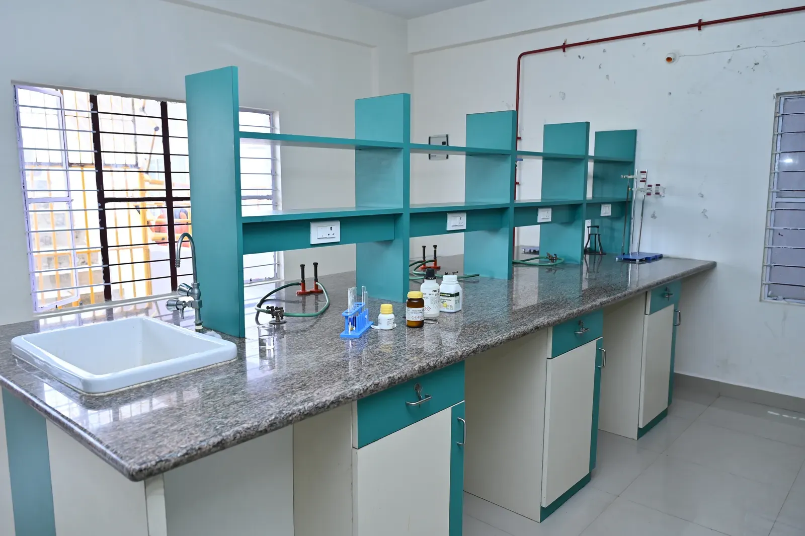 A composite chemistry lab bench with equipment and reagents