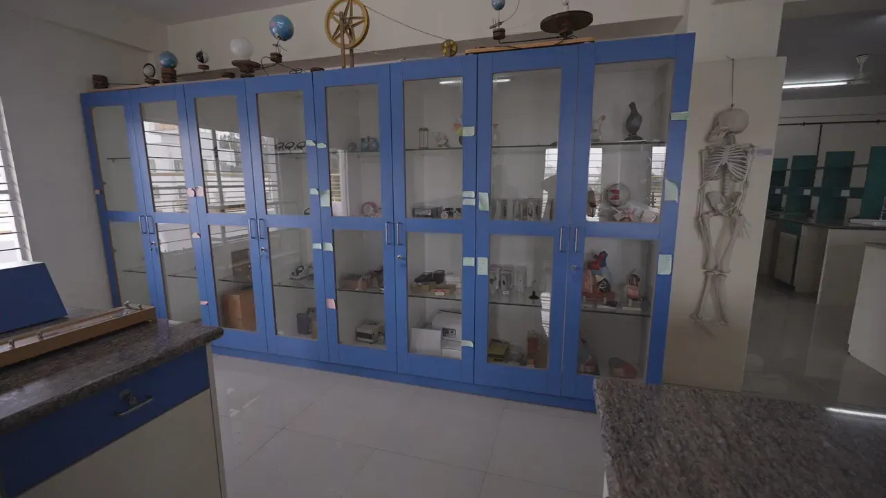A lab equipment cabinet with science apparatus