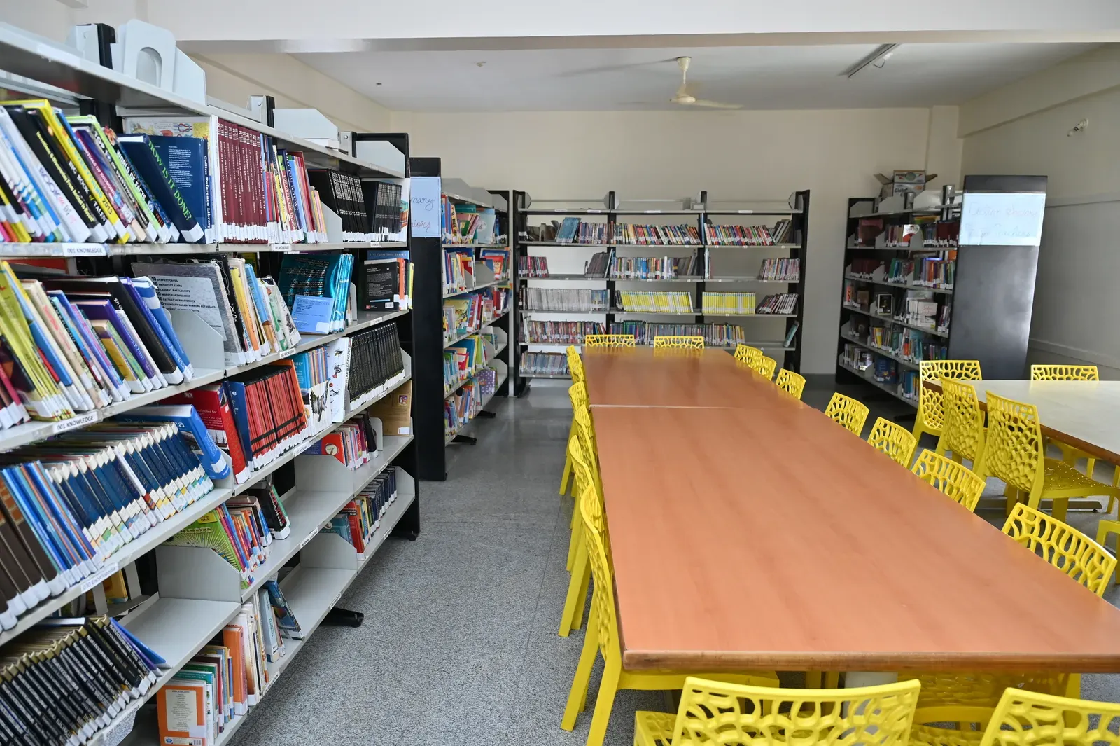 Rows of bookshelves in the school library