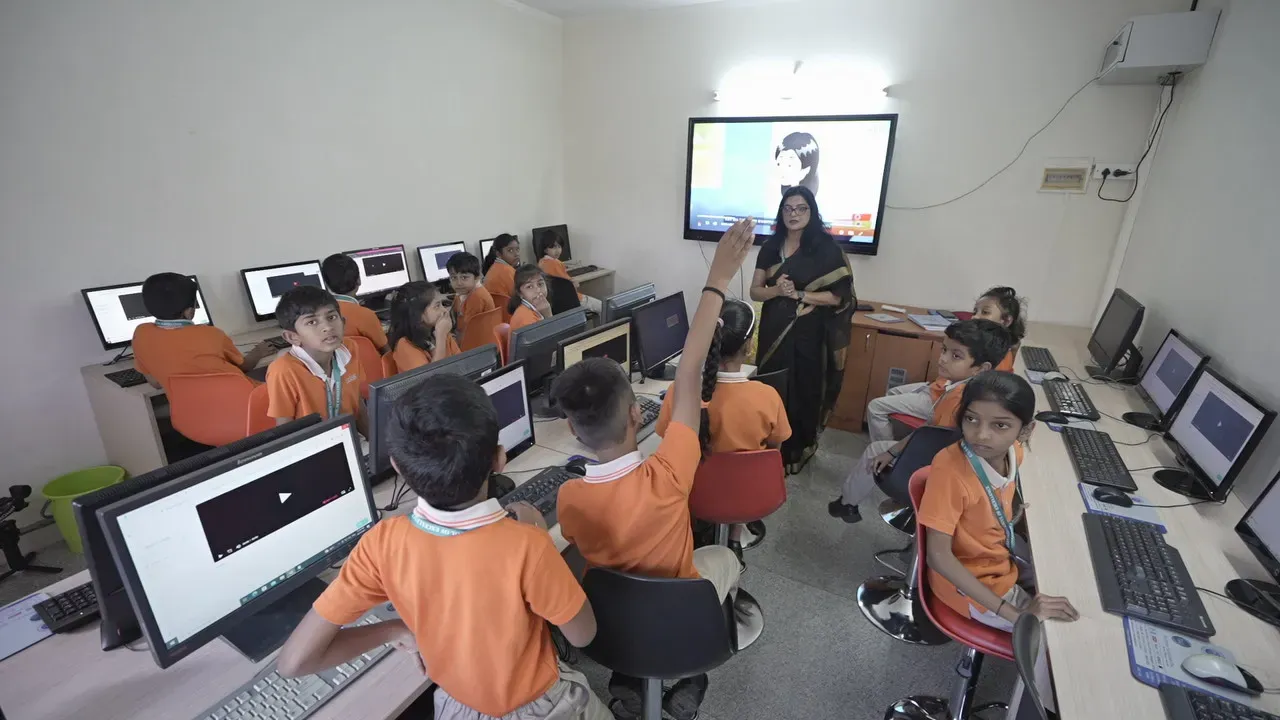 Students working at the computers in the school computer lab